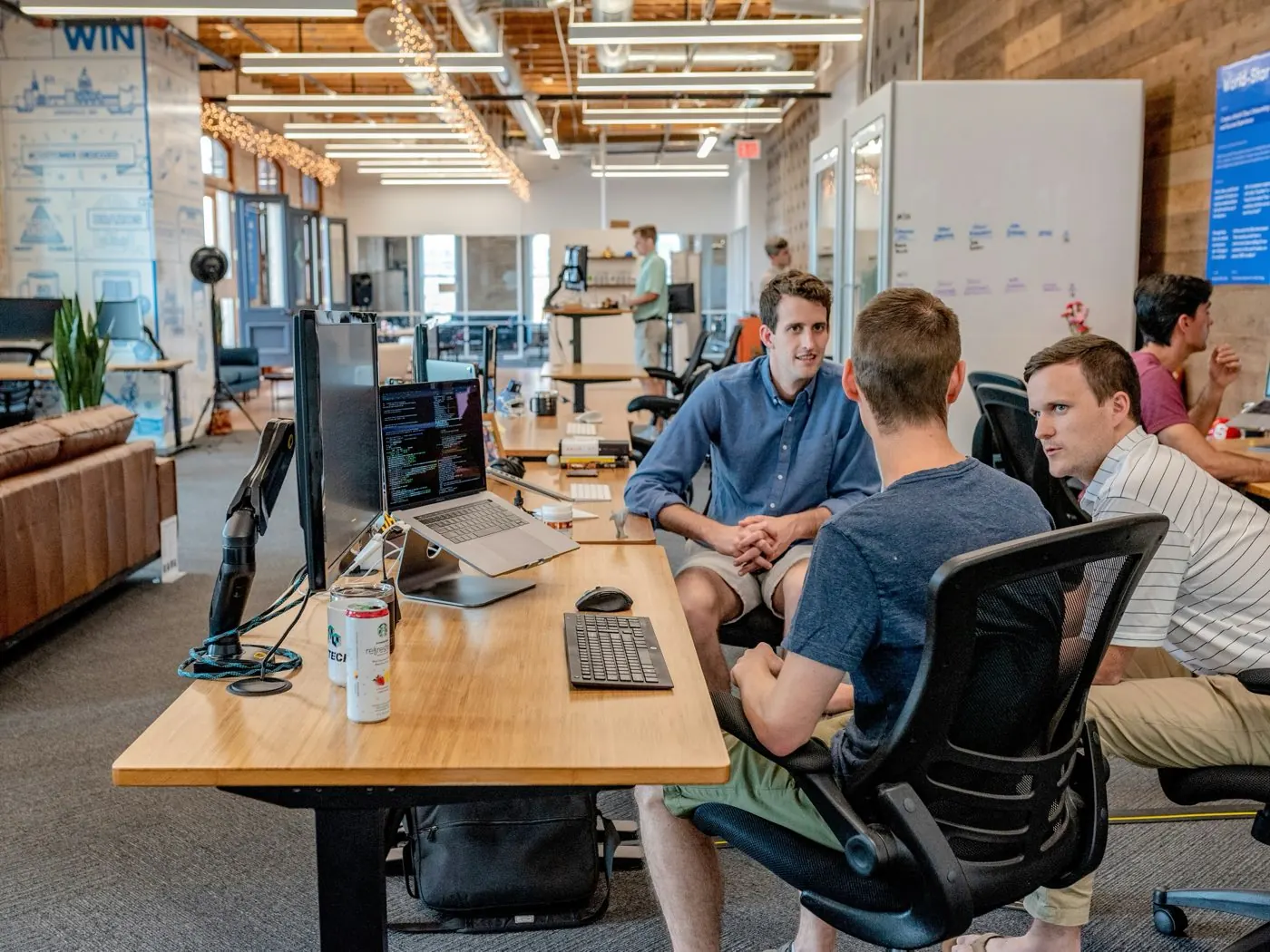 Engineers talking through a customer deployment at their desks